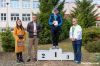 Biegacze stoją na podium